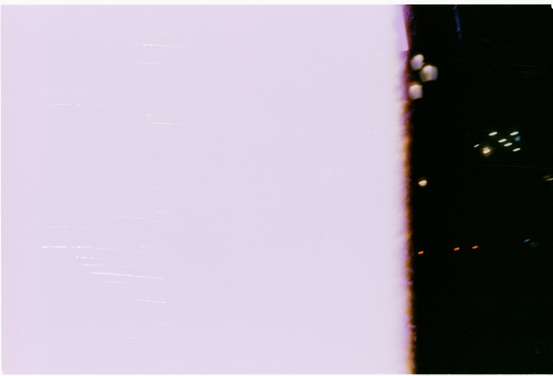 Bubbles rising in dark liquid next to light surface