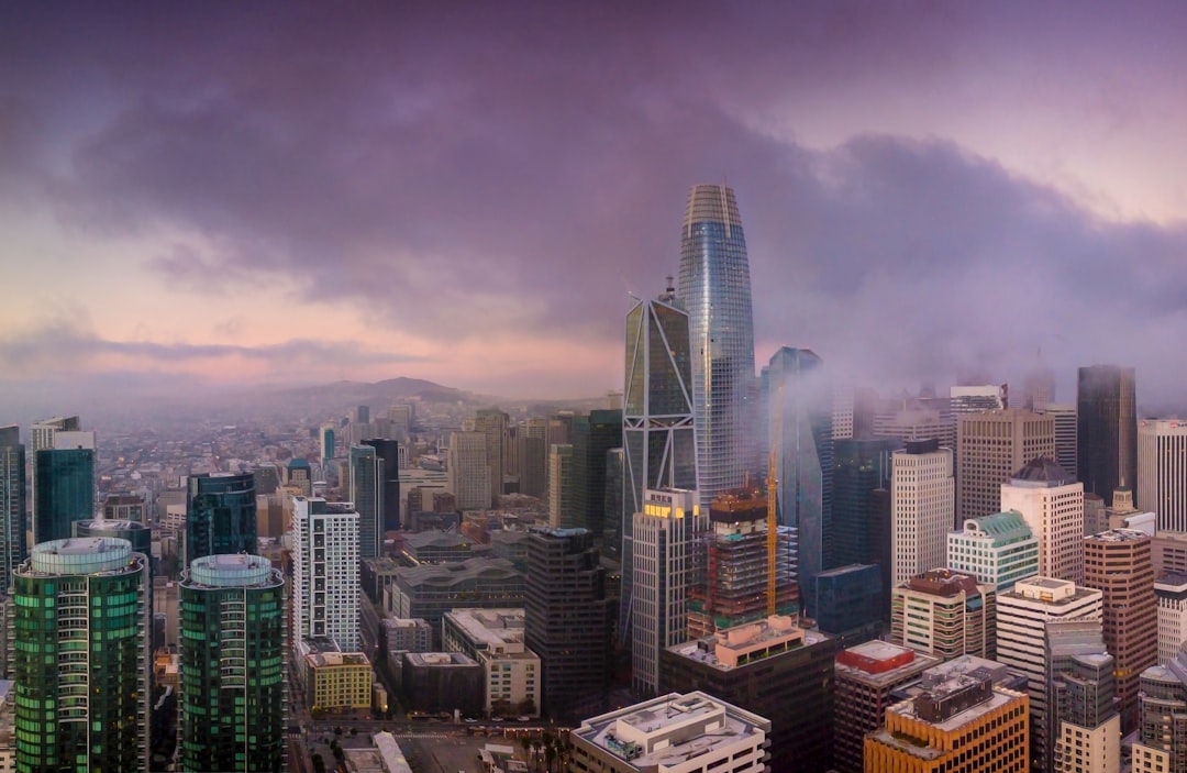 Skyscrapers in a city under a cloudy sky